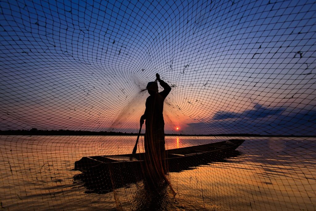 man, fishing net, lake-6342665.jpg